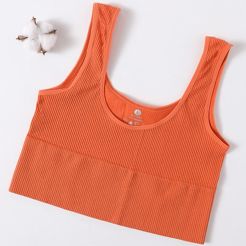Orange ribbed seamless sports tank top for women, perfect for yoga and fitness, featuring a stylish backless design. Model: SF0030.